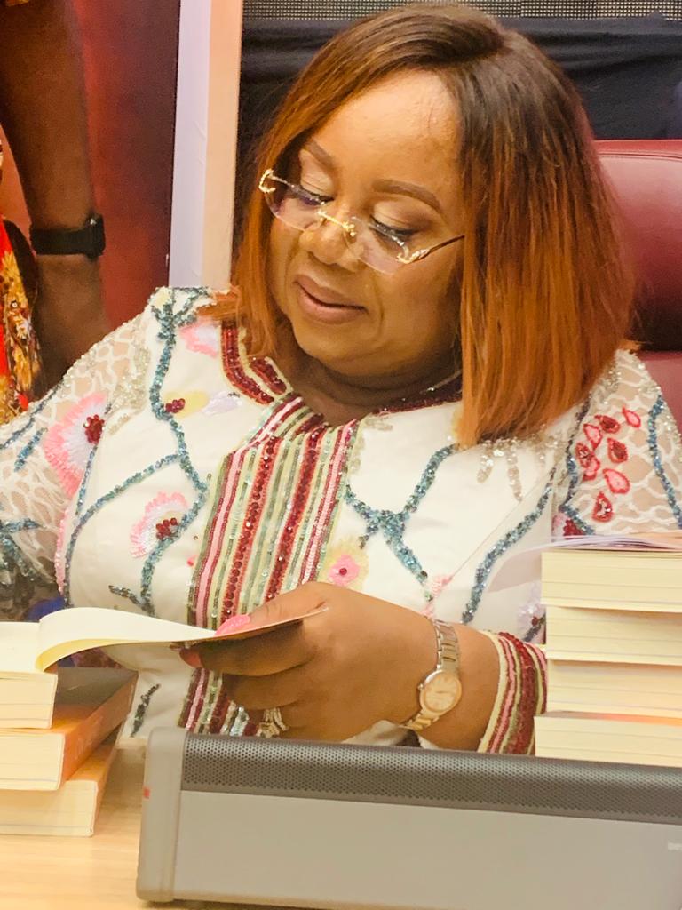 The Permanent Secretary, Ministry of Interior, Mrs Georgina Ehuriah-Arisa, launches a book titled “On Merit” to boost the morale of the Federal Public Servants.