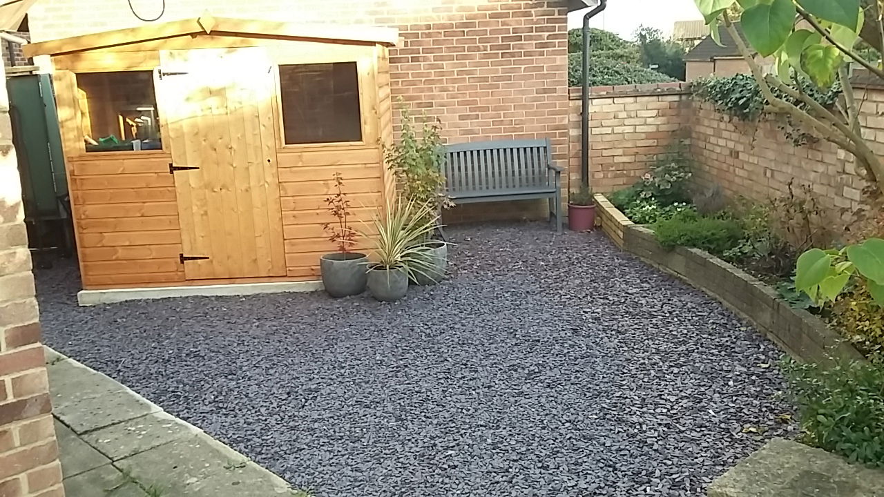 Concrete shed base and new gravel surface