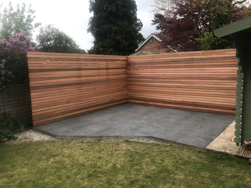 Design and construction of corner patio dining area with red cedar clad screening