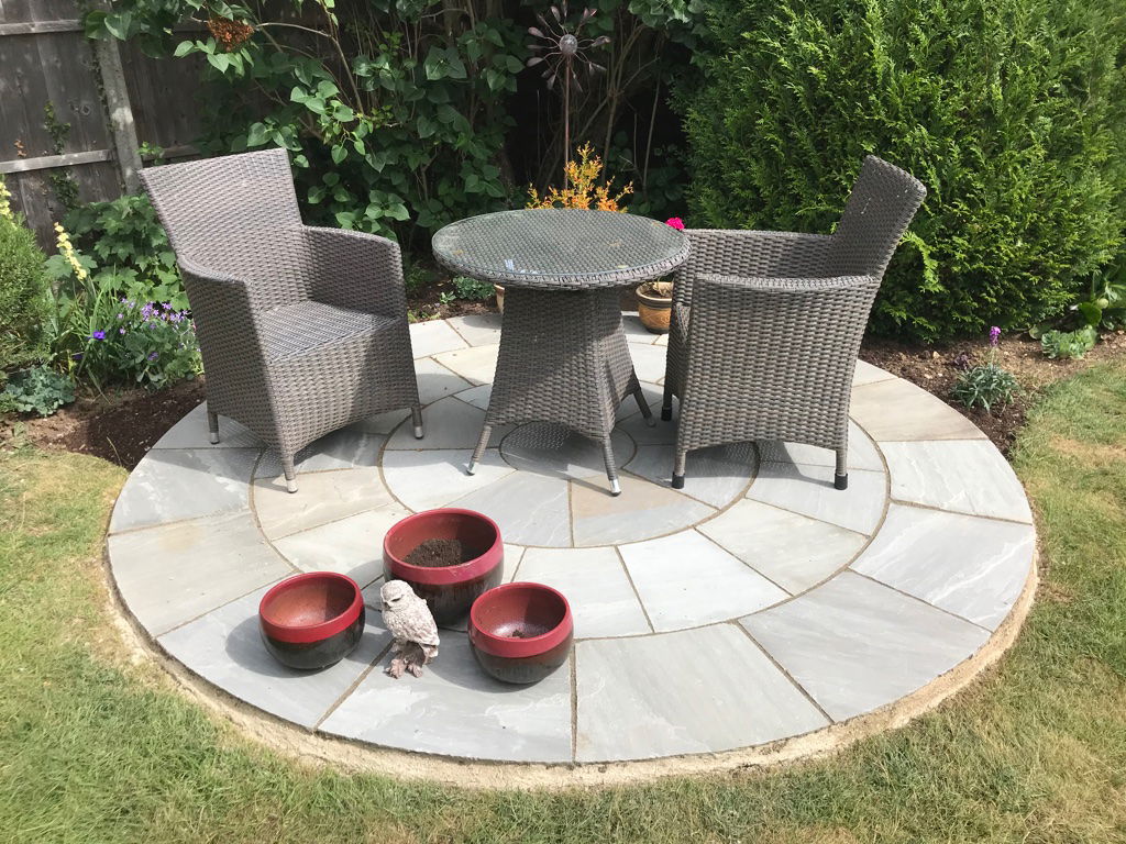 Building patio circle for seating area in garden sun trap