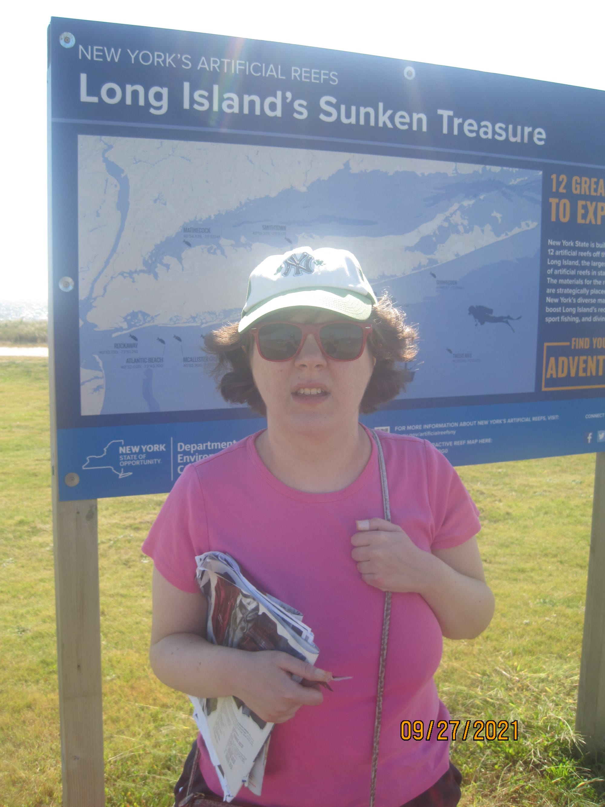 Eileen by a sign showing wrecks off of LI