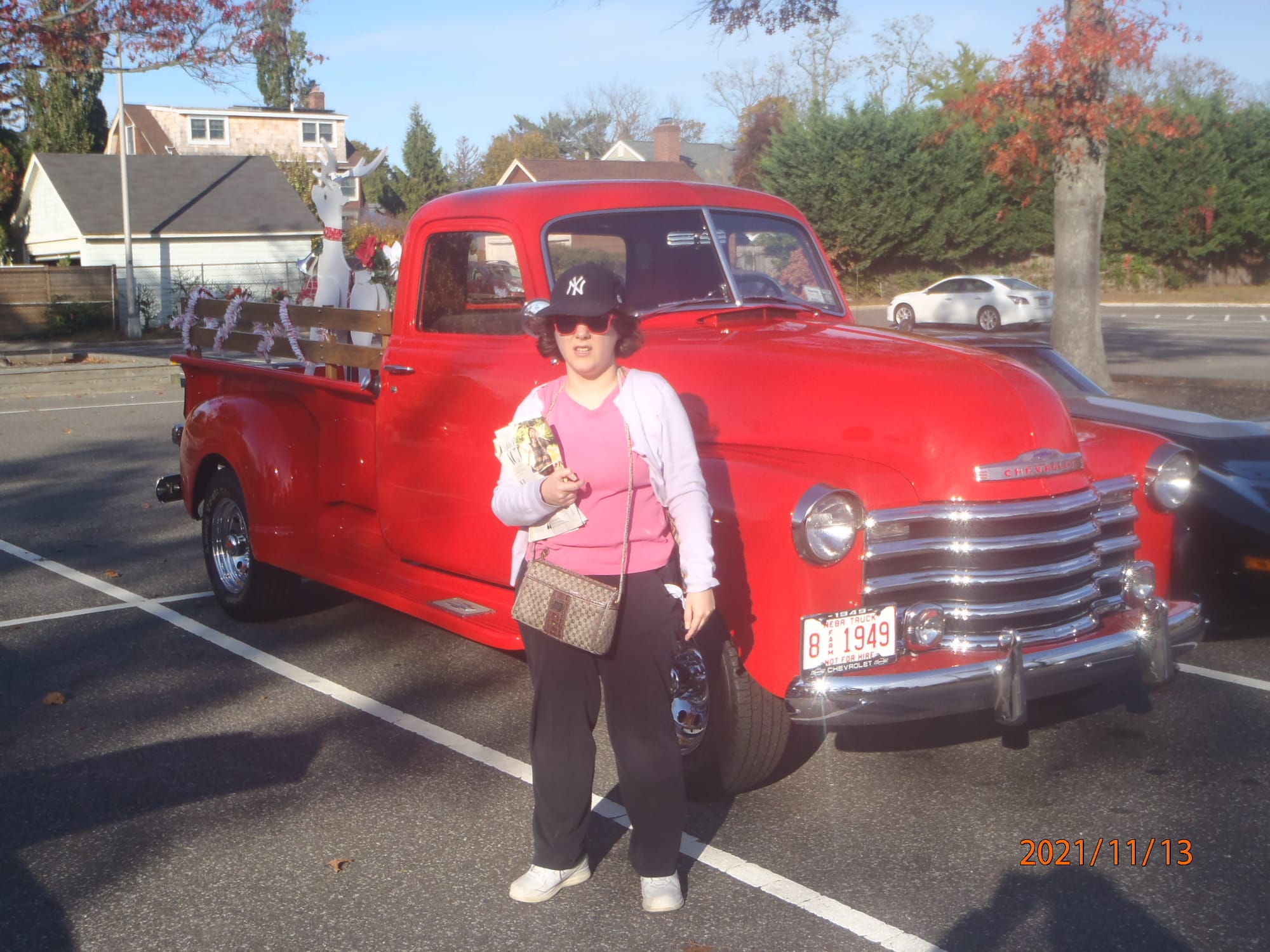 Eileen and the 1949 Chevrolet pickup in the Town Hall lot