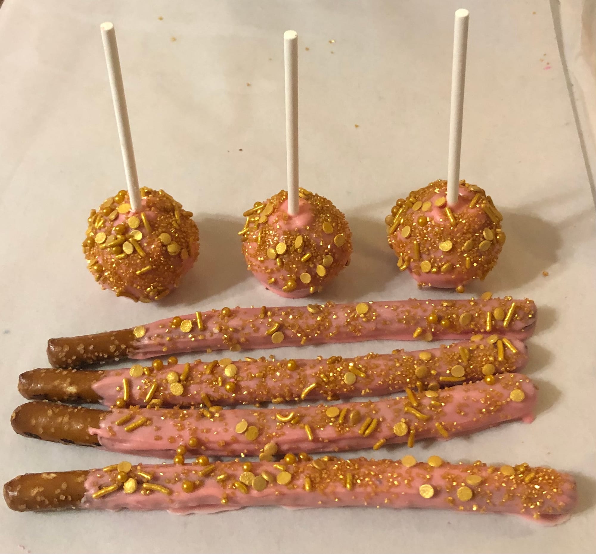 Truffle Style Chocolate Cake Pops In Light Pink & Gold With Matching Pretzels