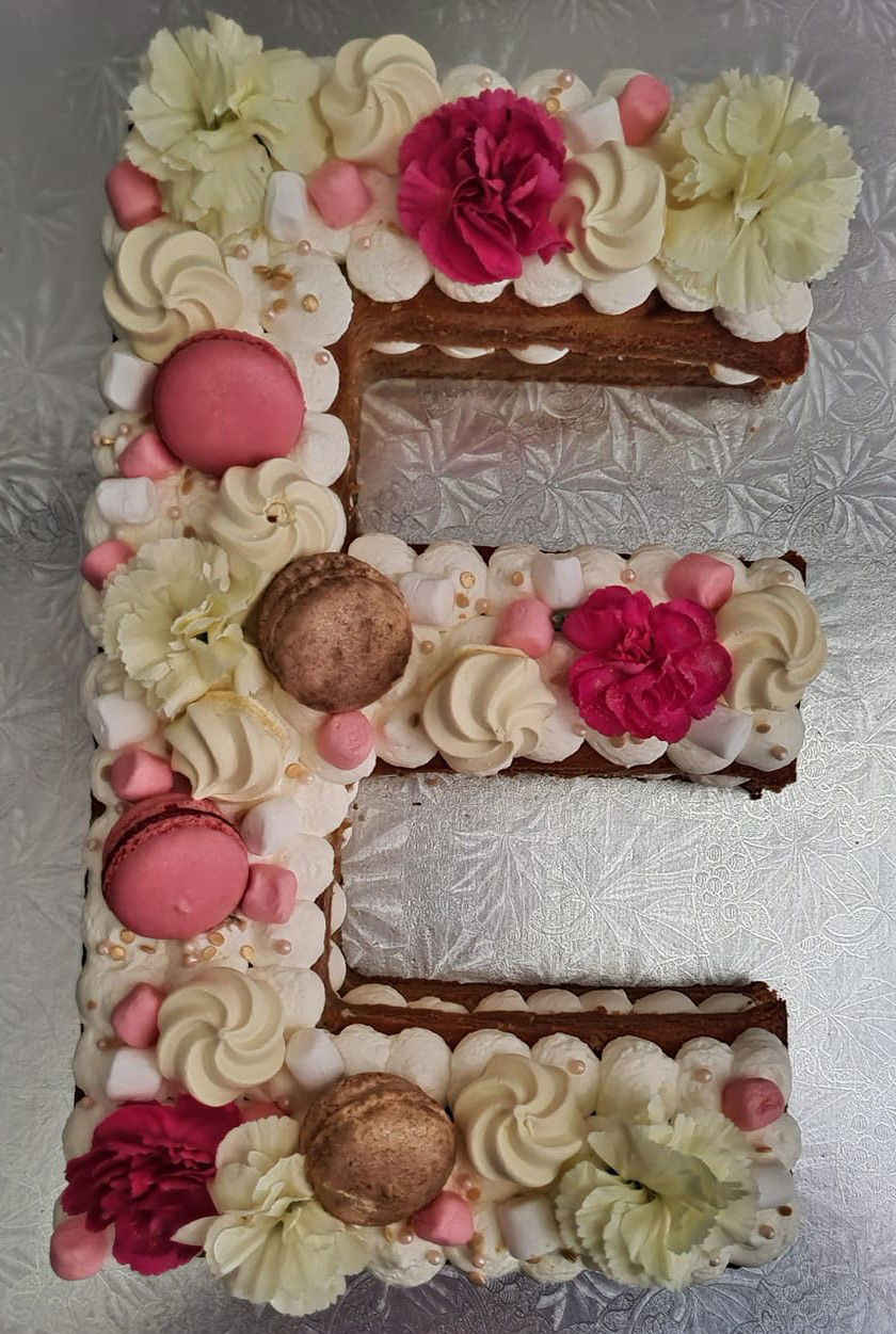 Letter E Cake With Buttercream Frosting and Macarons