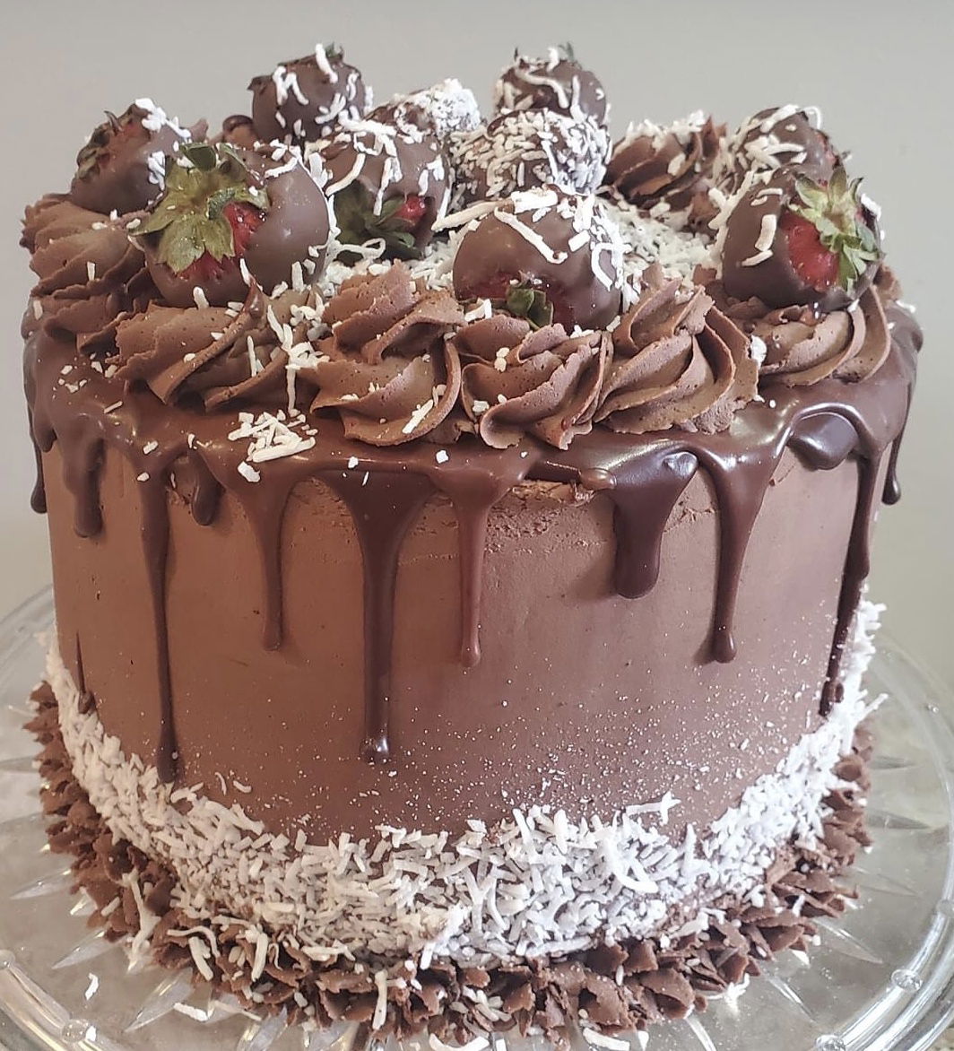 3 Layer Chocolate Cake With Buttercream Frosting, Chocolate Dipped Strawberries, and Coconut
