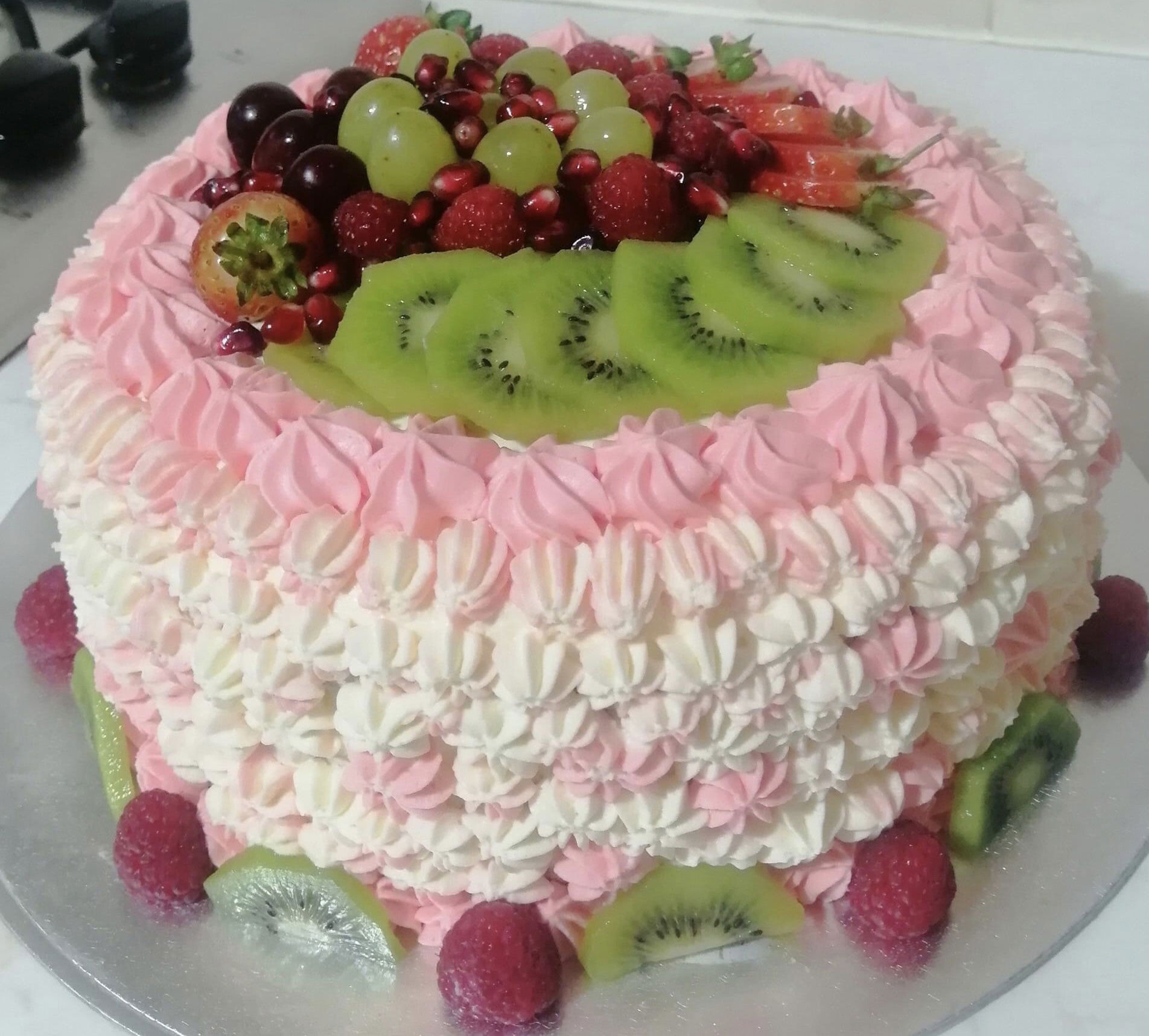 2 Layer Vanilla Cake With Raspberry Filling, Buttercream Frosting, and Fresh Fruit