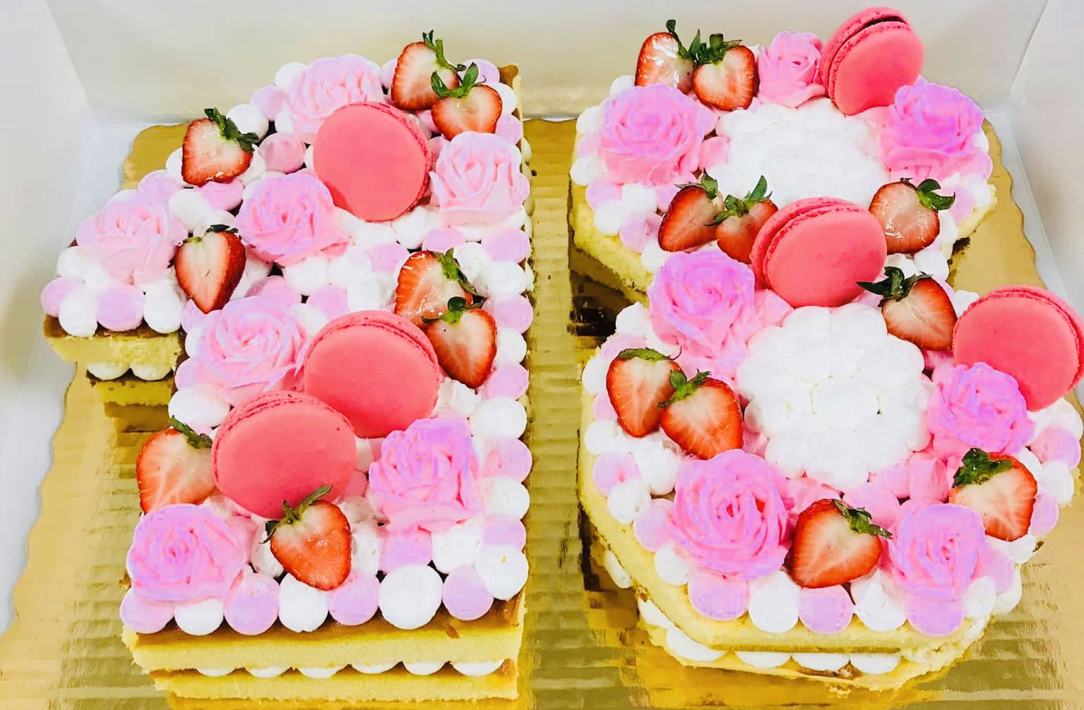 Number 18 Vanilla Cake With Buttercream Frosting, Fresh Strawberries, and Macaron’s