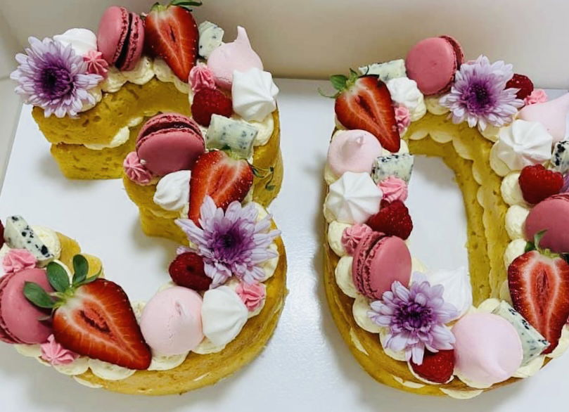 Number 30 Vanilla Cake with Buttercream Frosting, Macarons, and Fresh Strawberries
