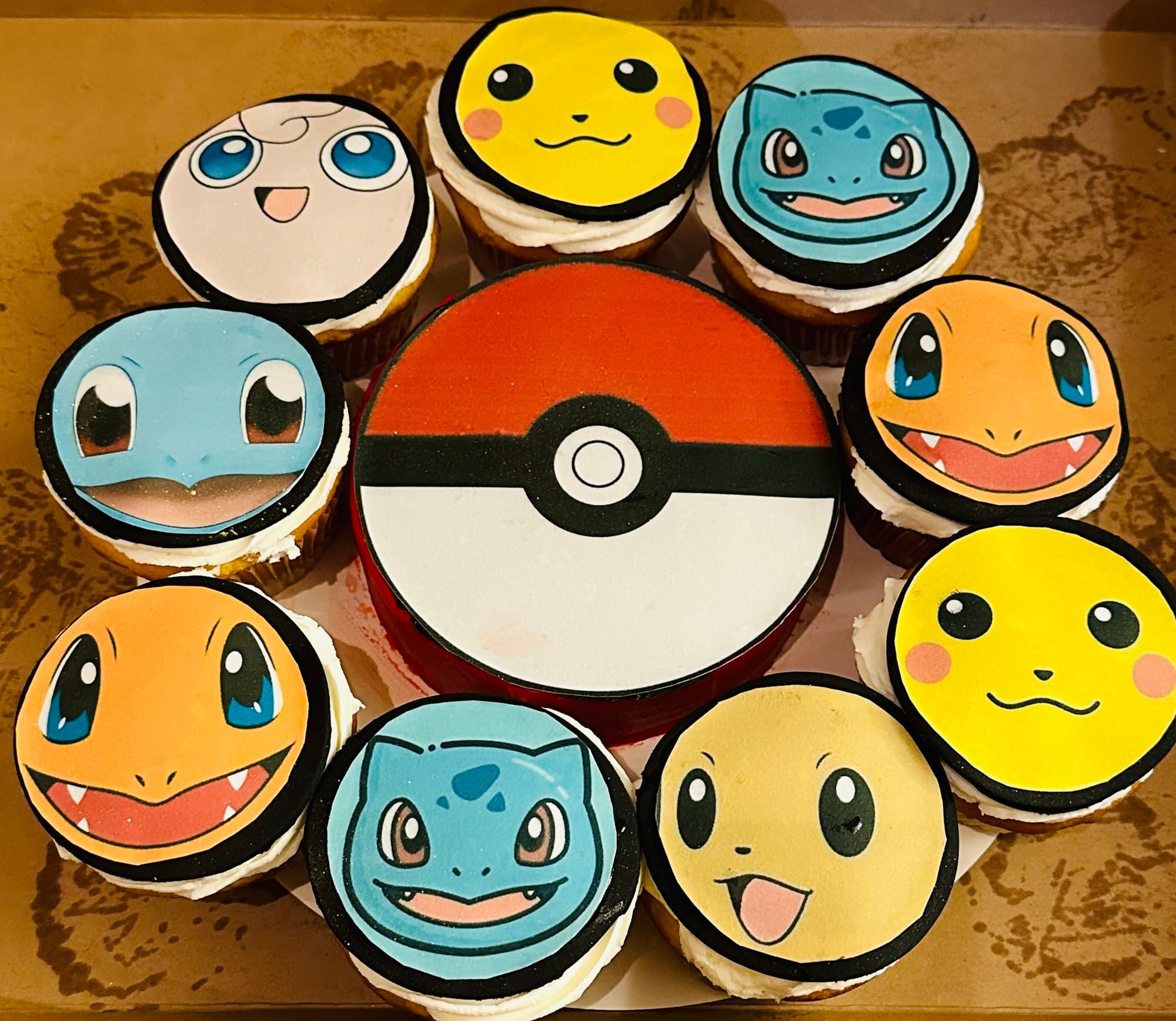 Vanilla Pokémon Cupcakes and 1 Layer 6” Chocolate Pokeball Cake with Buttercream Frosting, Fondant, and Edible Images