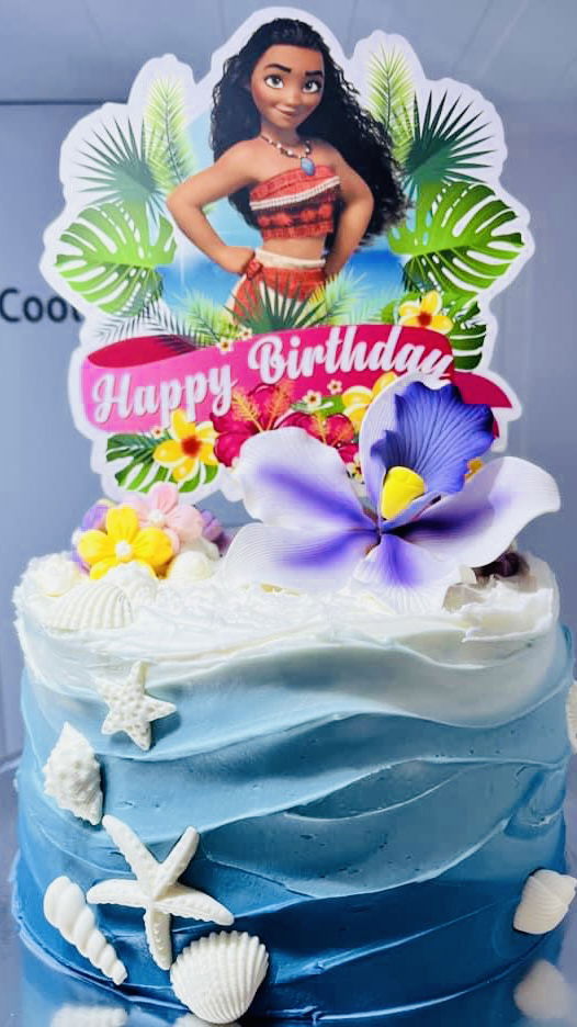 3 Layer Chocolate, Vanilla, and Strawberry Moana Cake with Buttercream Frosting, and White Chocolate Candies