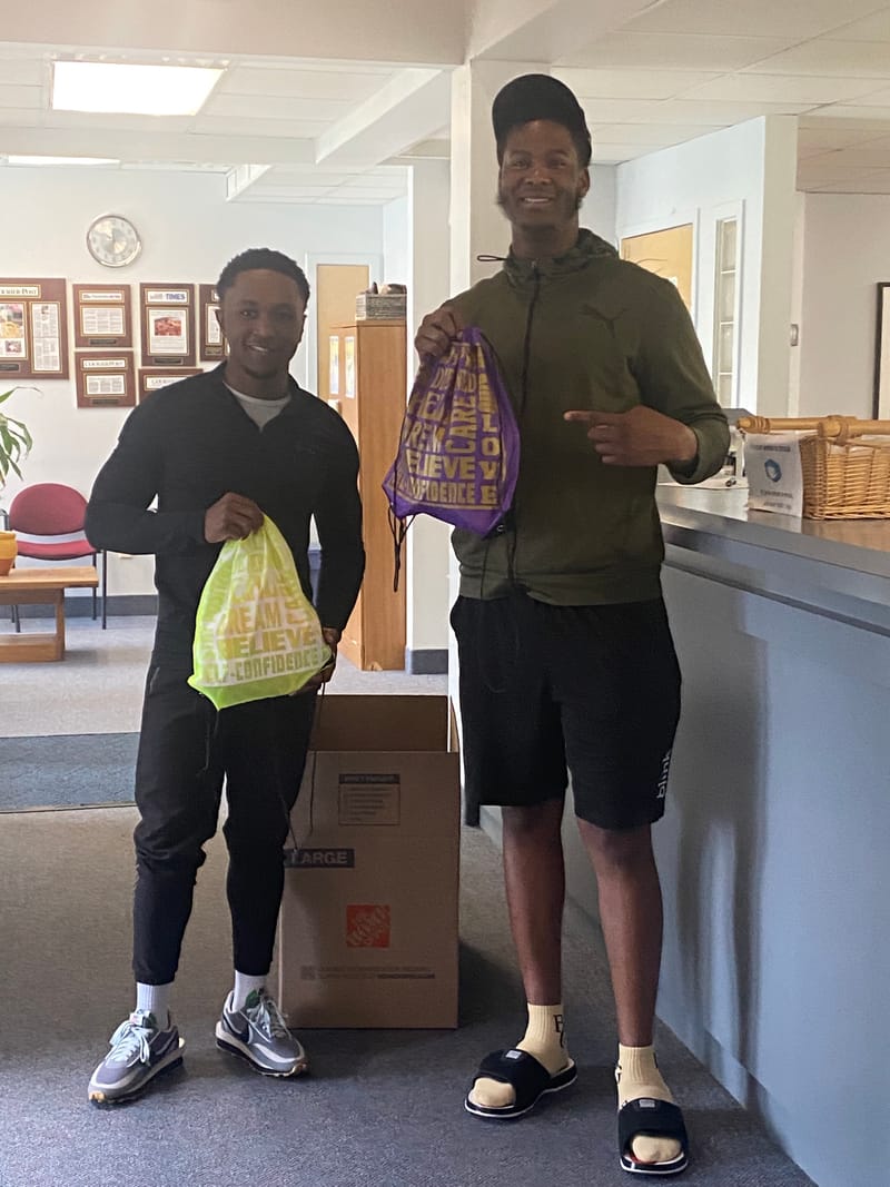 Marcus Jr and James deliver donations to the Crossroads Program on 5/2/22.