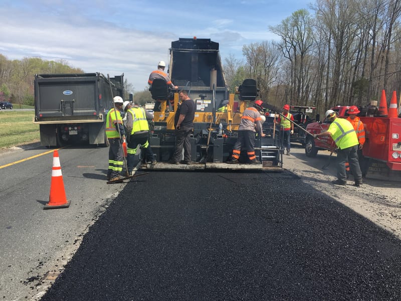 Paving new asphalt roads for homes and business centers