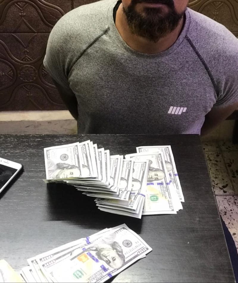 بغداد: اعتقال شخص حاول تصريف 5400 دولار مزورة