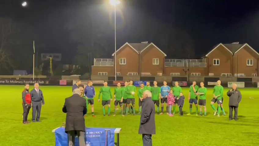Caleb lifting the trophy