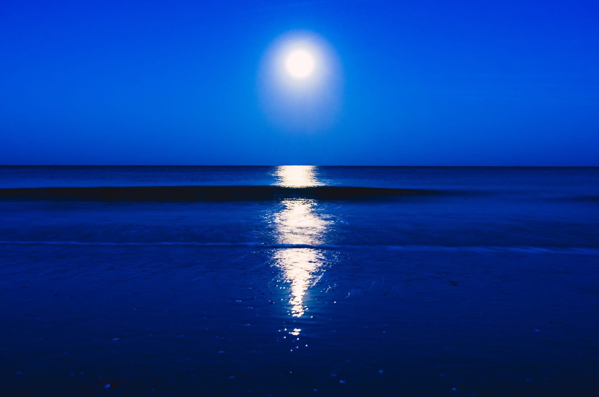 SUNRISE OVER QUIET BLUE OCEAN IN MARCO ISLAND, FL