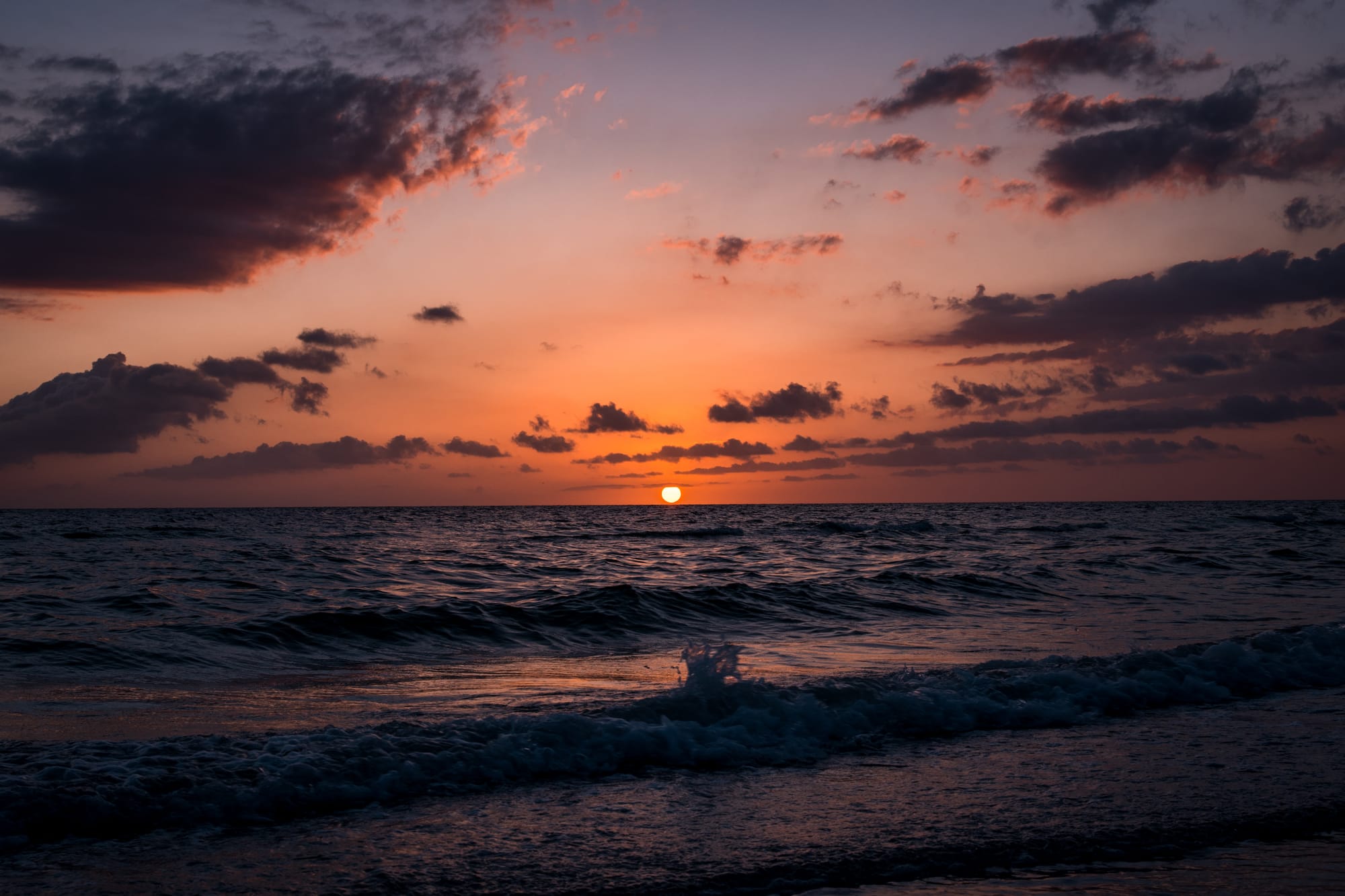 SUNSET OVER THE OCEAN IN MARCO ISLAND, FL