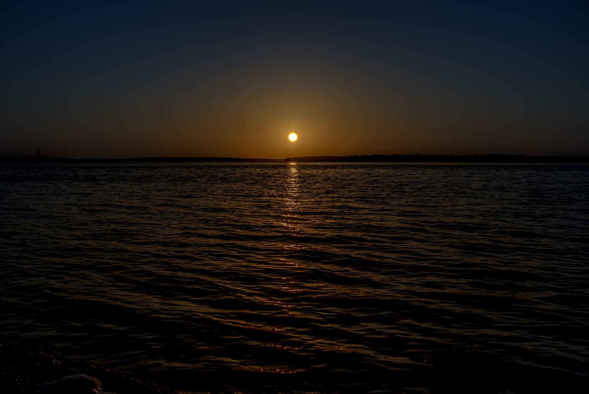 SUNRISE OVER QUIET BLUE OCEAN IN MARCO ISLAND, FL