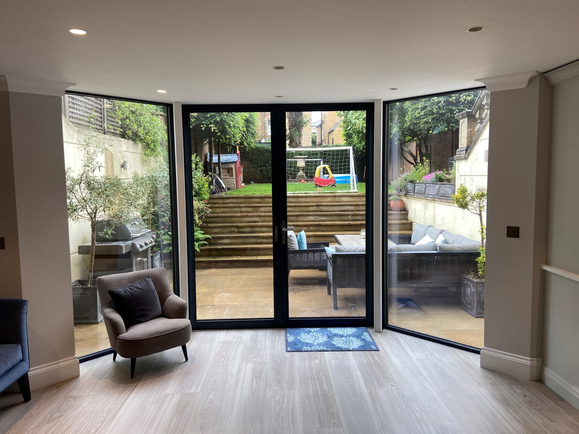 Minimalist glazing installed in place of timber French Doors & Sash windows. Feels like the patio & garden are part of the kitchen