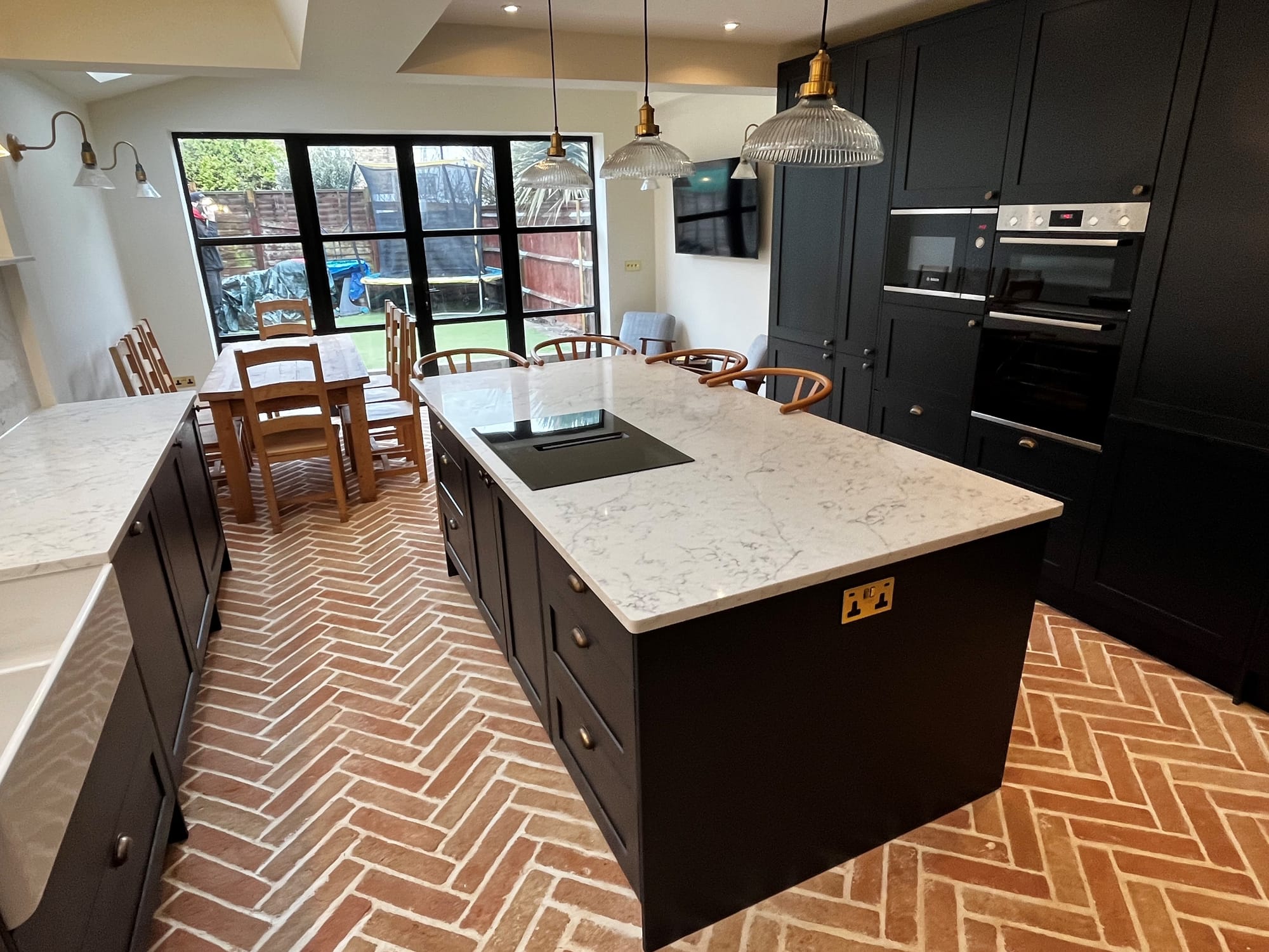 Balham SW12 kitchen side return extension with Crittal Style French doors & rustic terracotta parquet tiles.