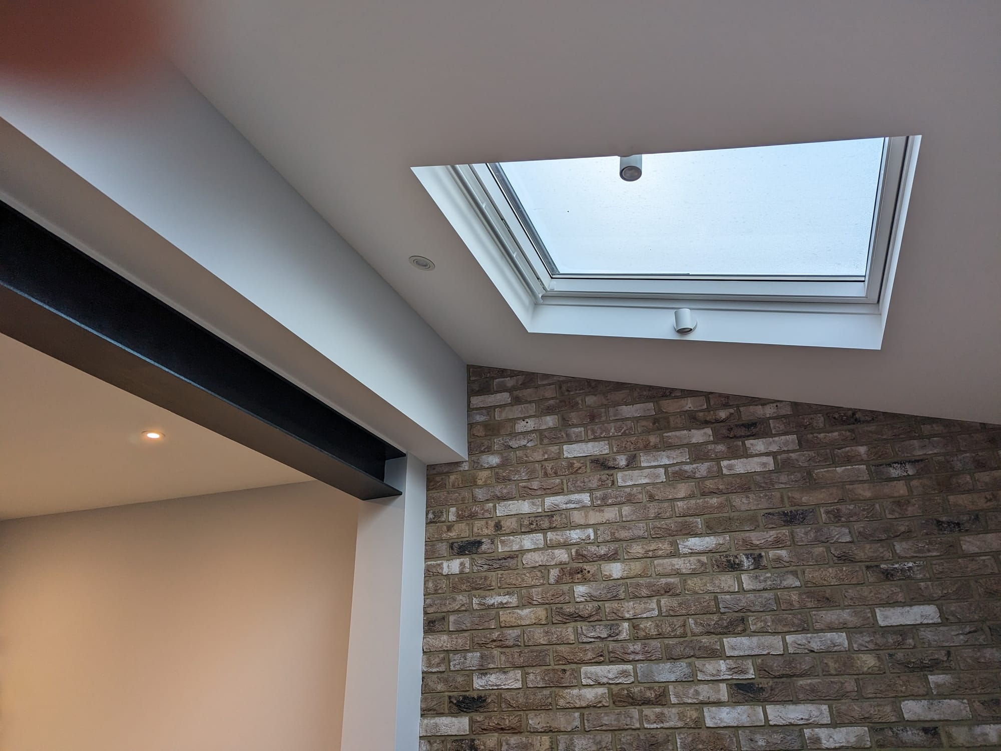 Southfields grid (SW18) - kitchen extension, brick slips, velux and painted exposed steel