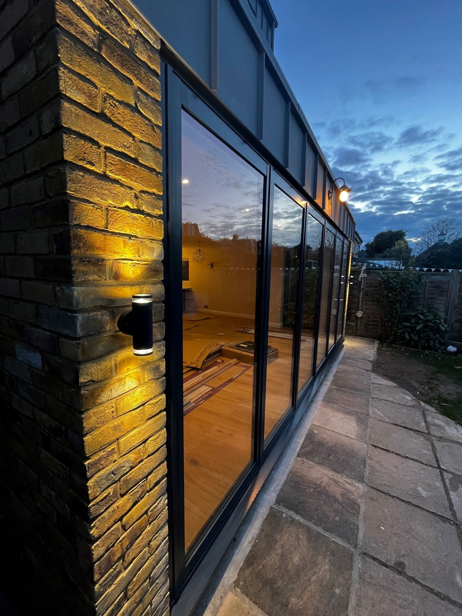 Sinc cladding with up down lights look great on this London Stock kitchen extension in Wandsworth SW18