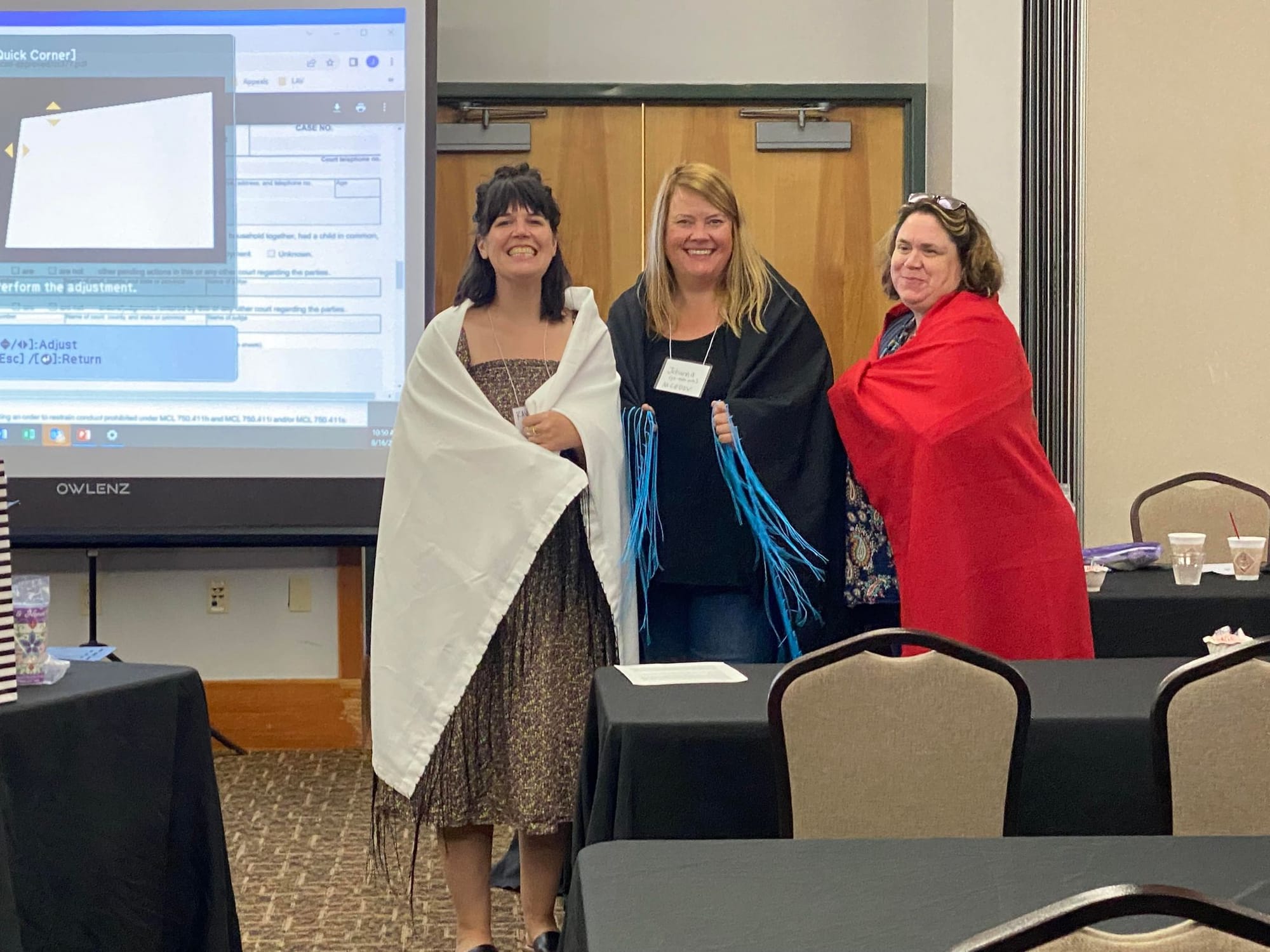 Presenters Kayt, Johanna, and Sarah with their new shawls!