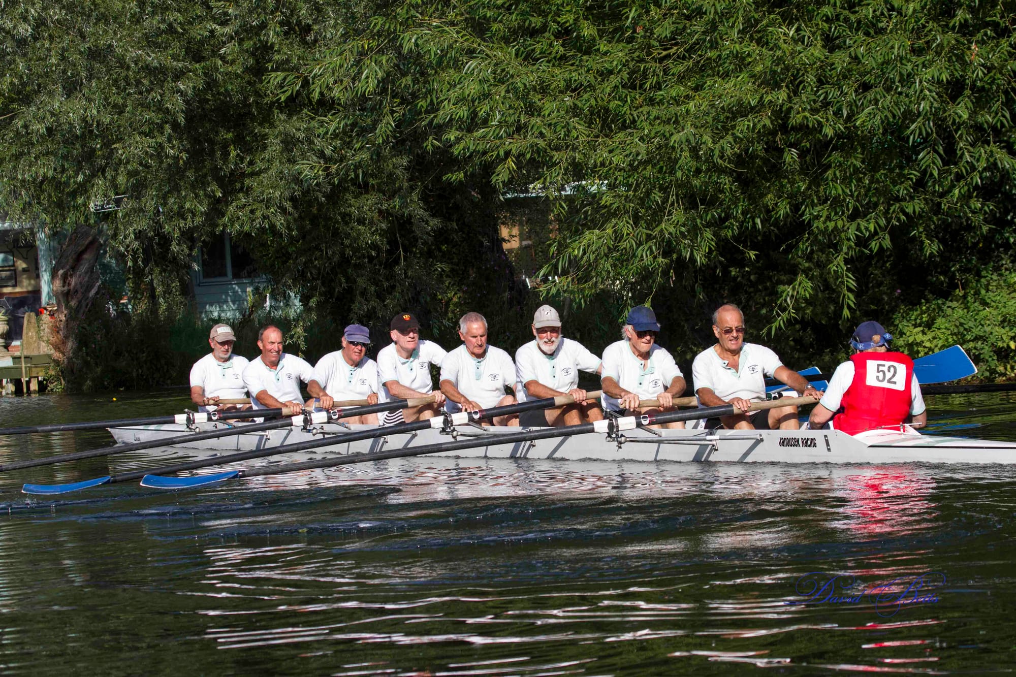 The Veterans team rowing down to the start