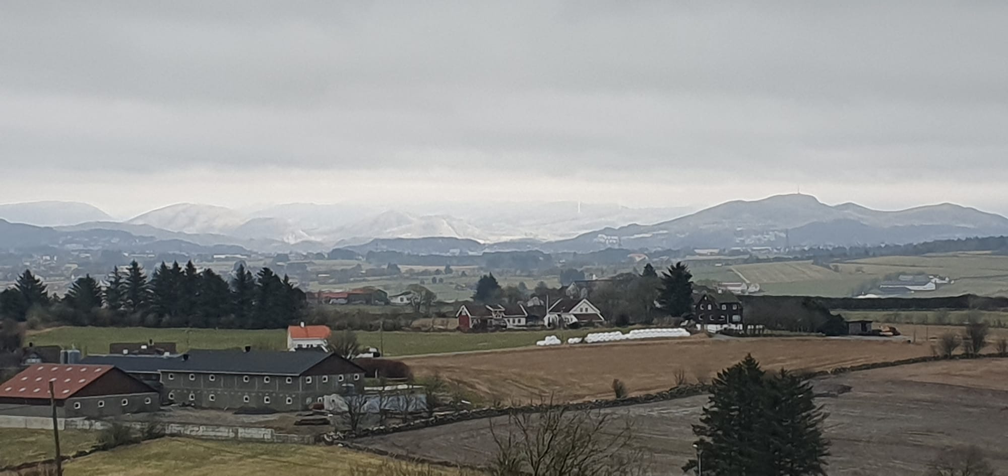 Sun in the background on mountains and windmills,picture taken from tjelta Church 19.03.2023 with Samsung s10 e