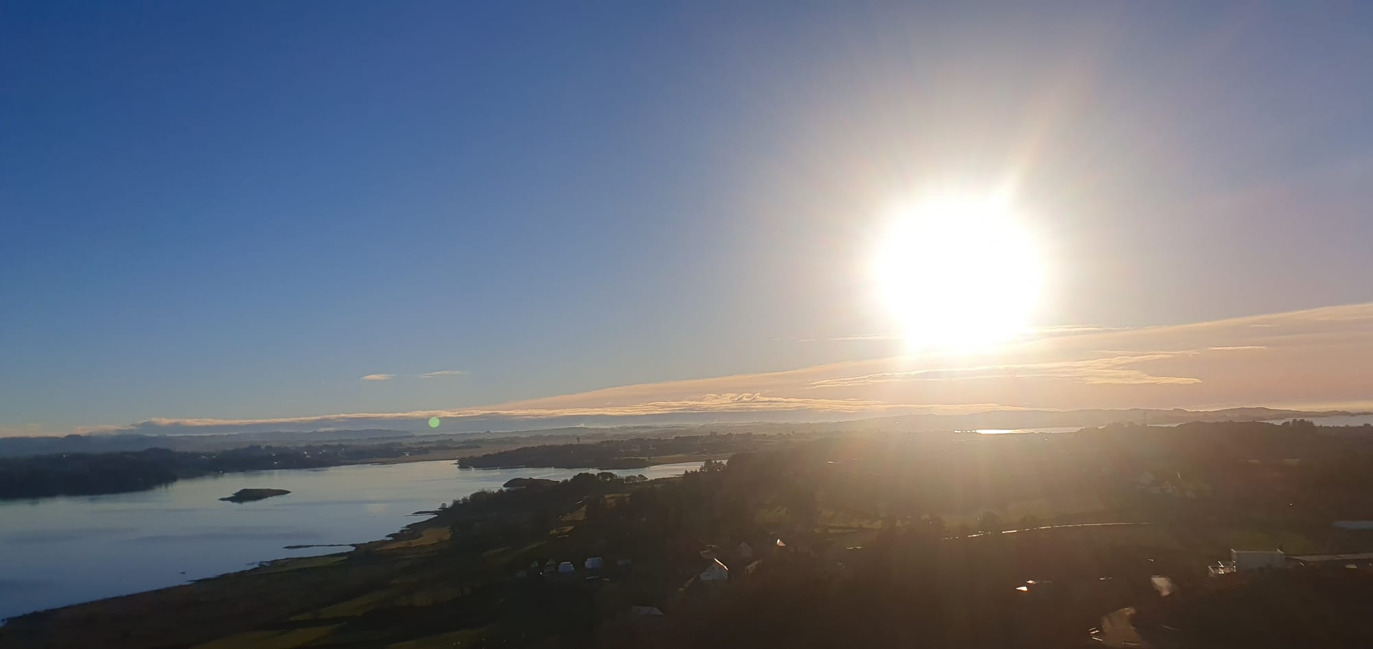 View to sola and sola airport Hafrsfjord in the front  dec 2023 And the sun