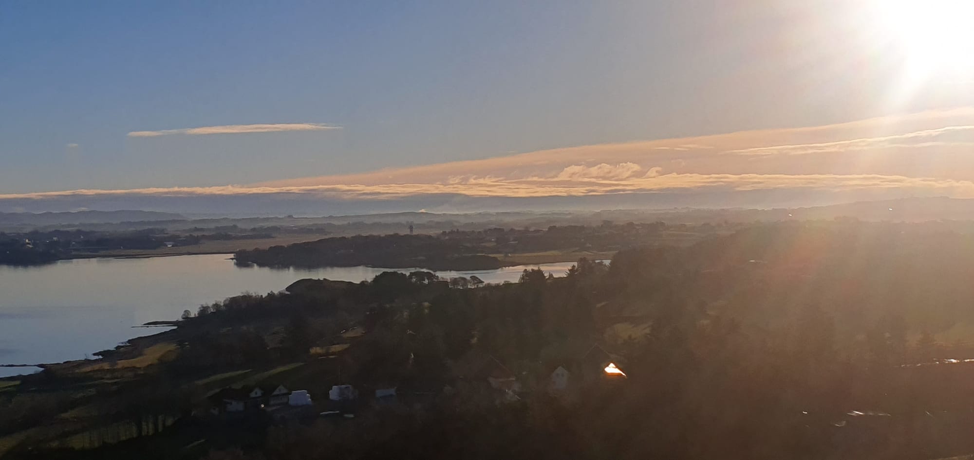 View to sola and sola airport Hafrsfjord in the front  dec 2023 And the sun