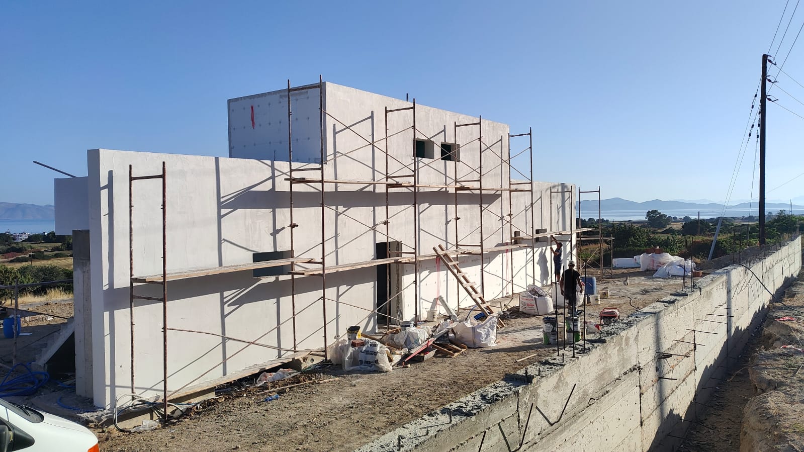 Construction of a two 2-store houses in Mastichari area with pools