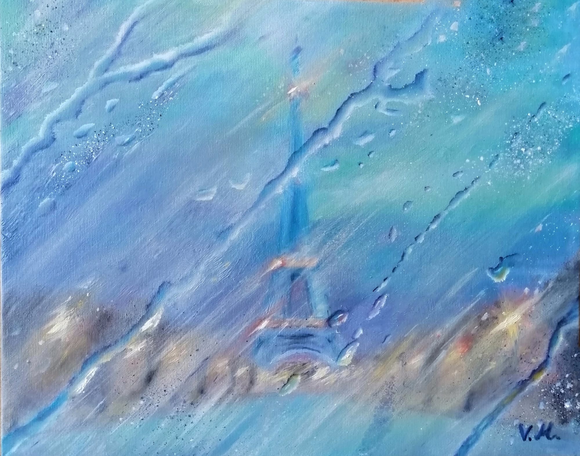 Lights of Paris behind wet glass