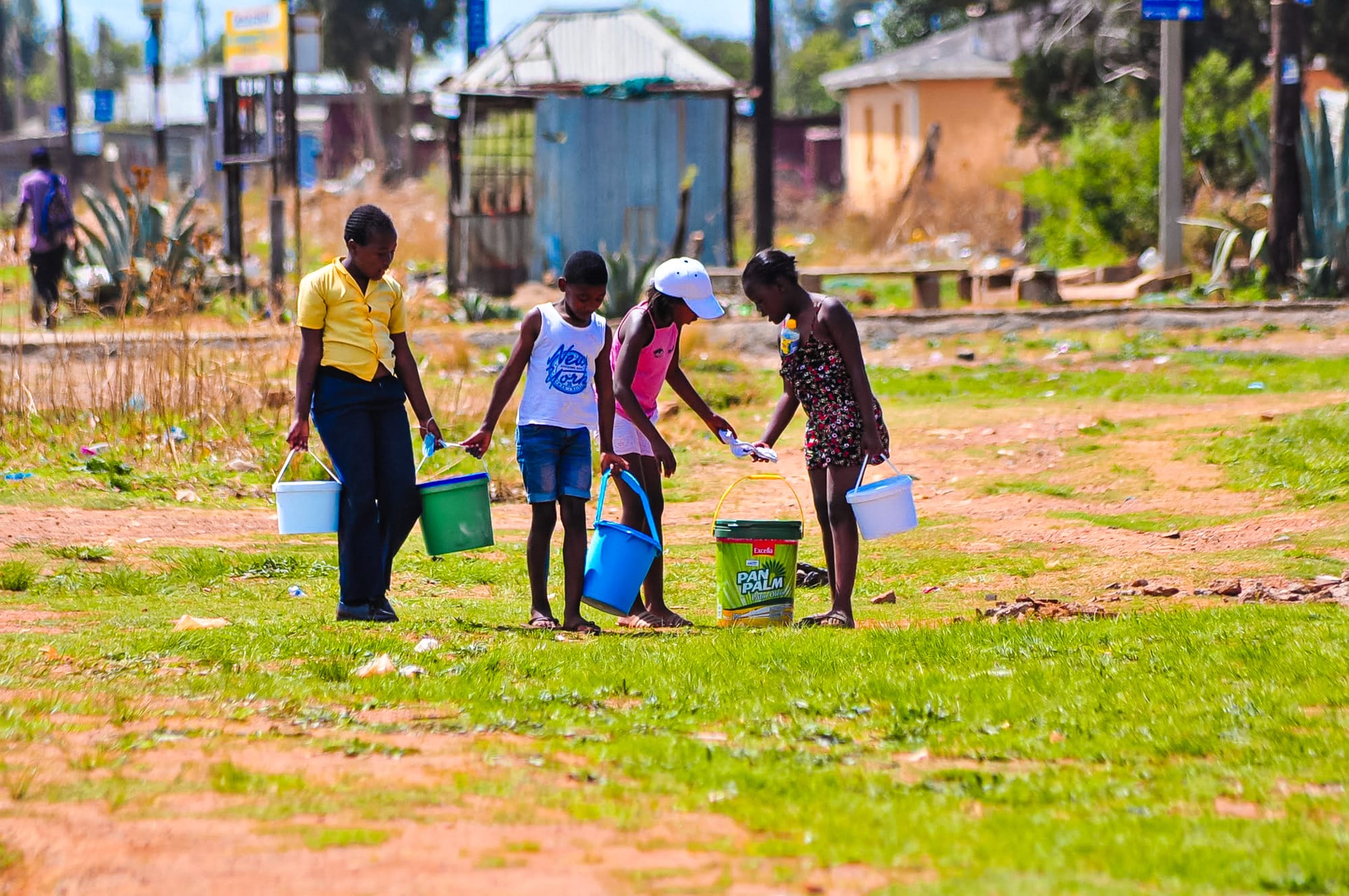 Vaal drought, children are seen holding buckets of water following a long drought.