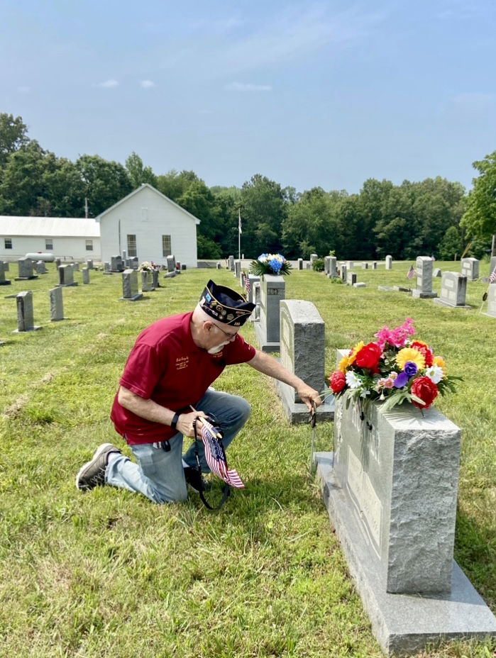 Bob Grigsby placing a Flag