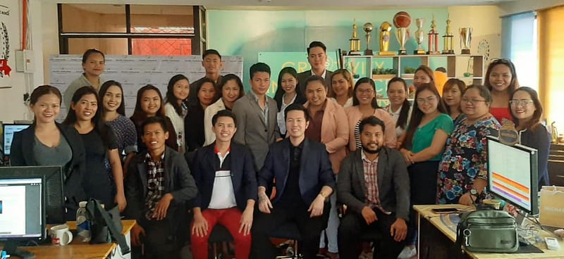 Diverse team members collaborating on a project board