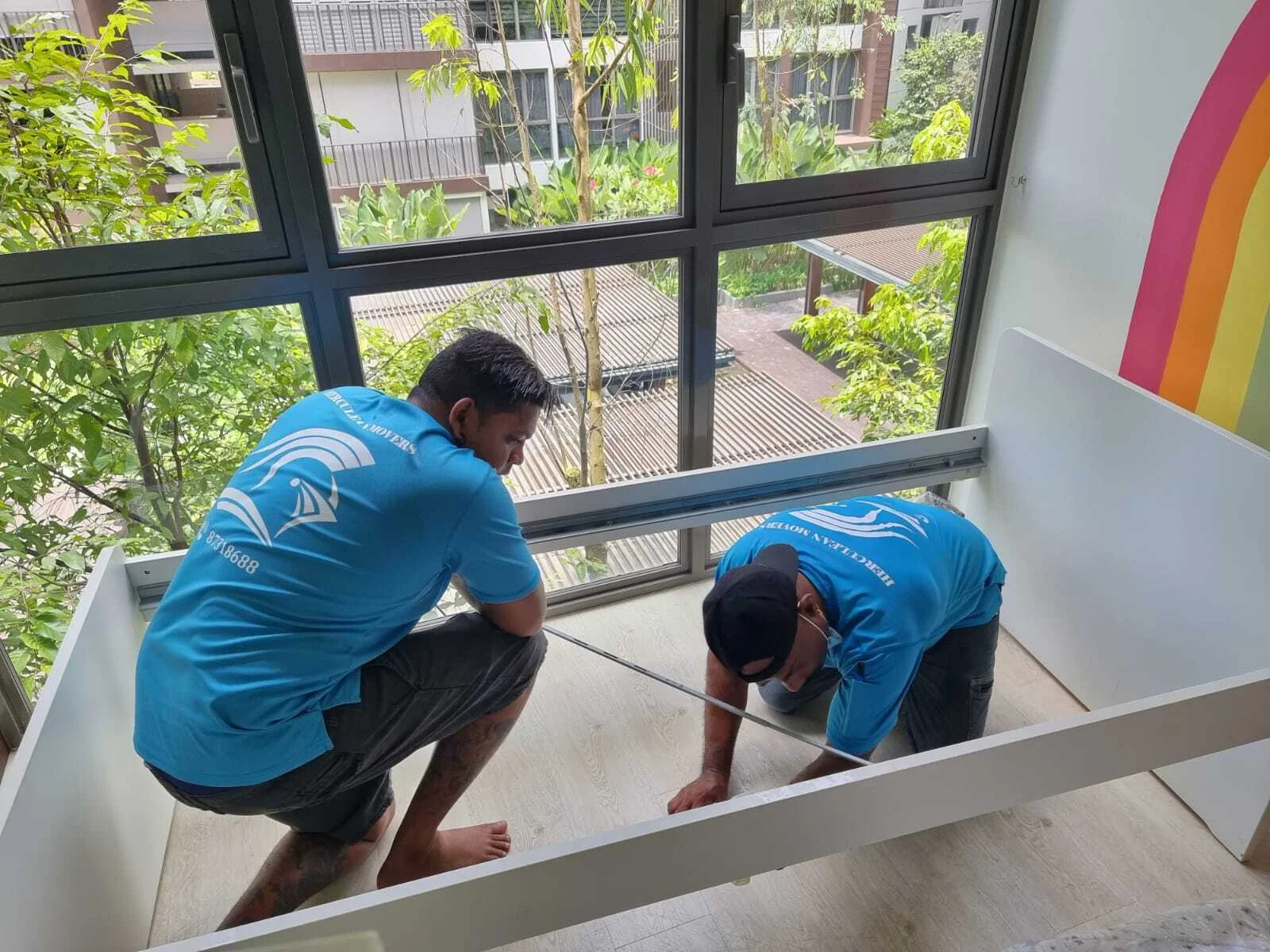 movers inspecting bed frame