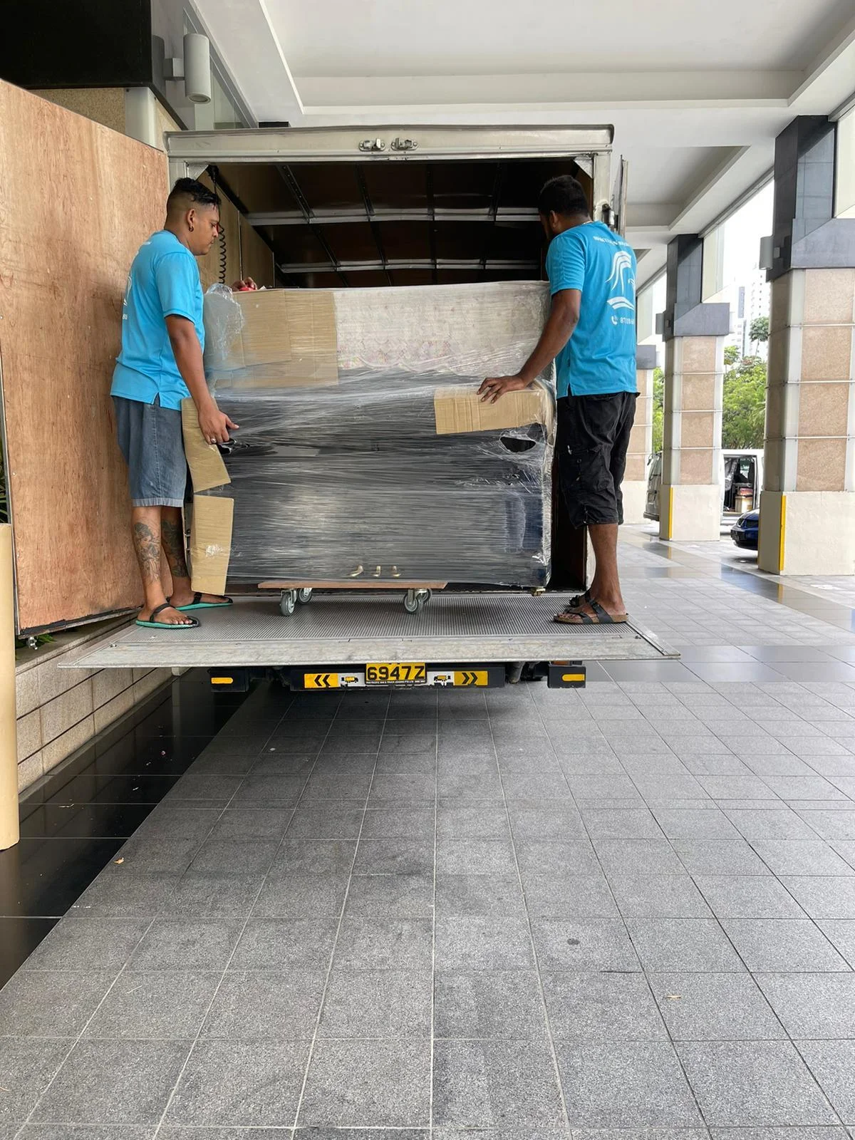 moving piano into truck