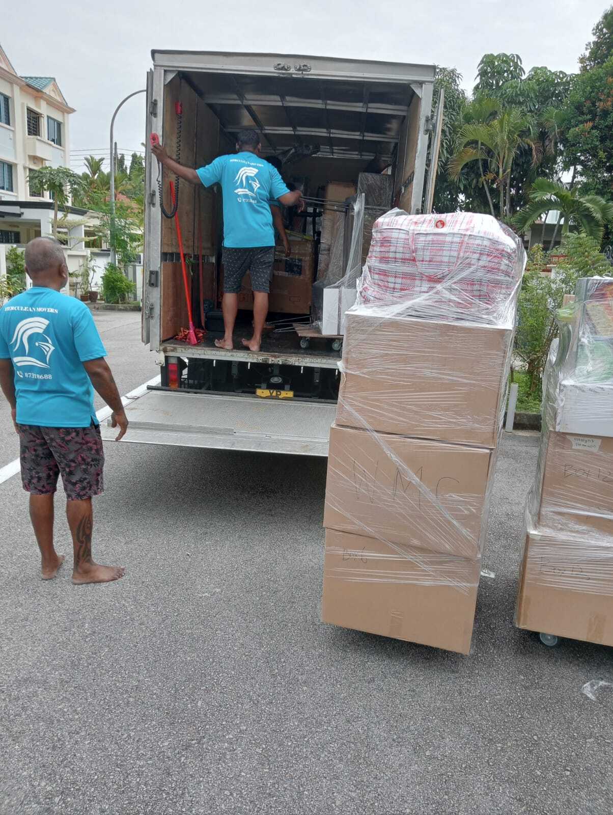 organizing items into moving truck