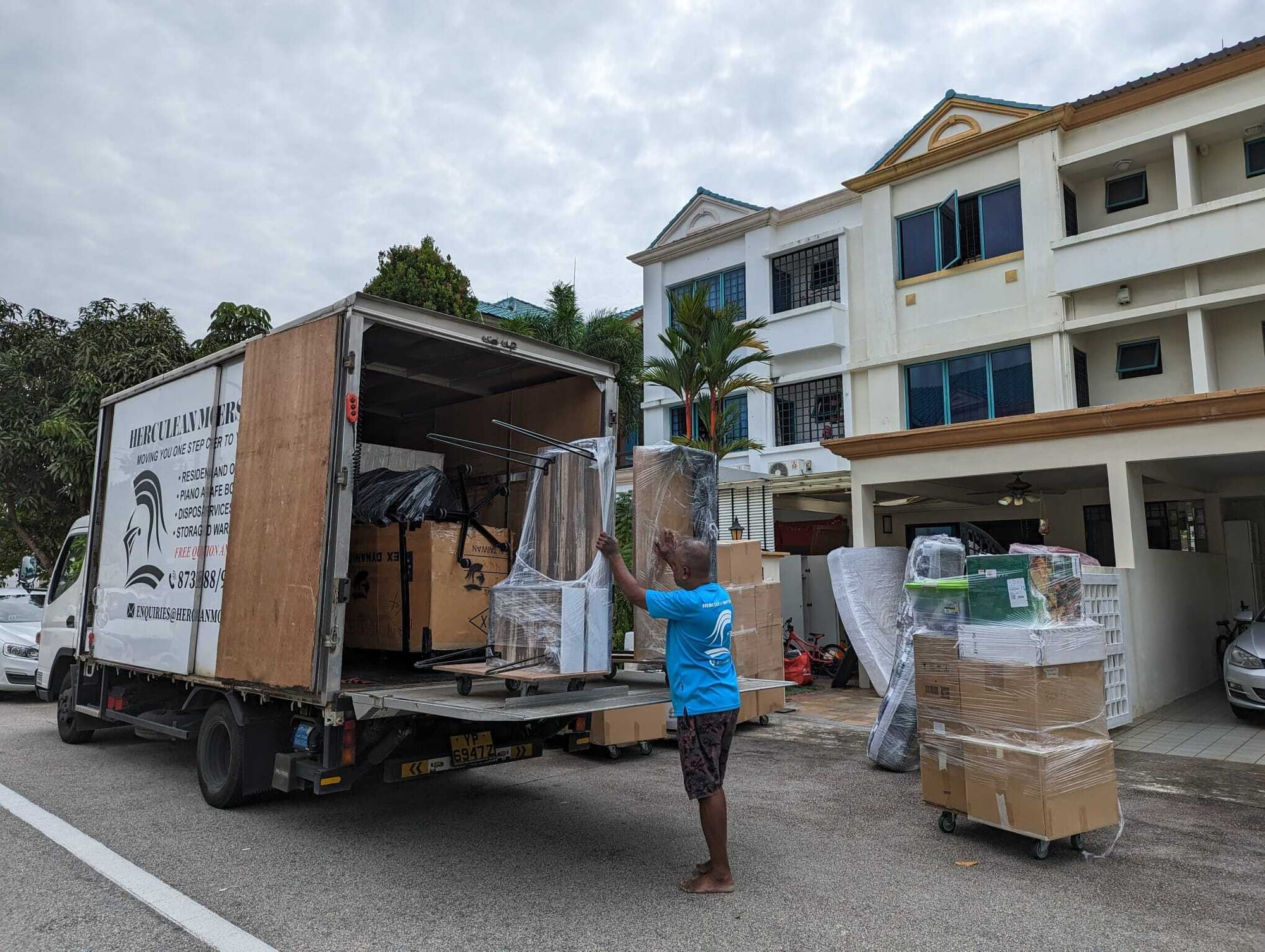 movers loading furniture into truck