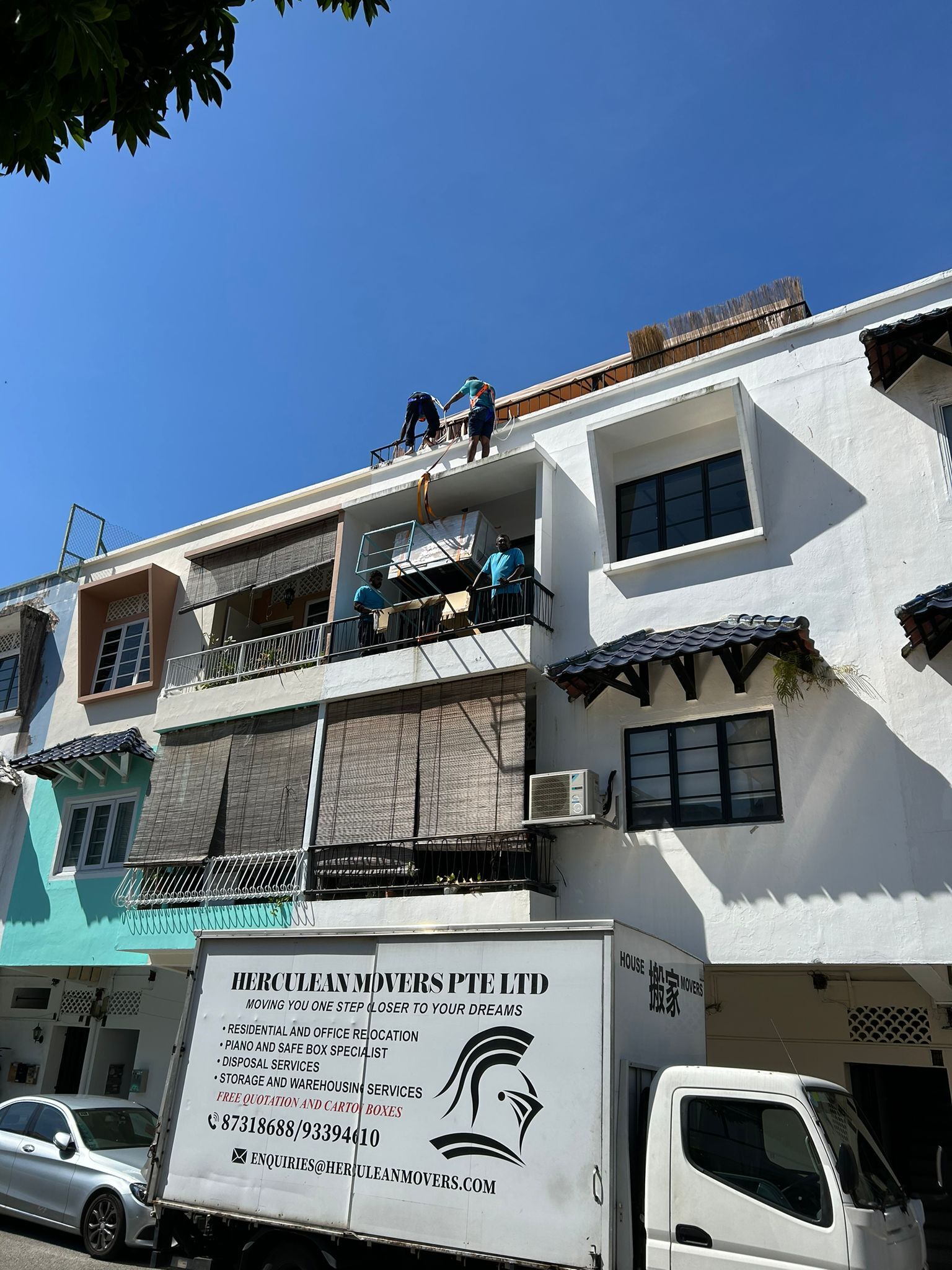 picture of fridge move via hoisting to roof