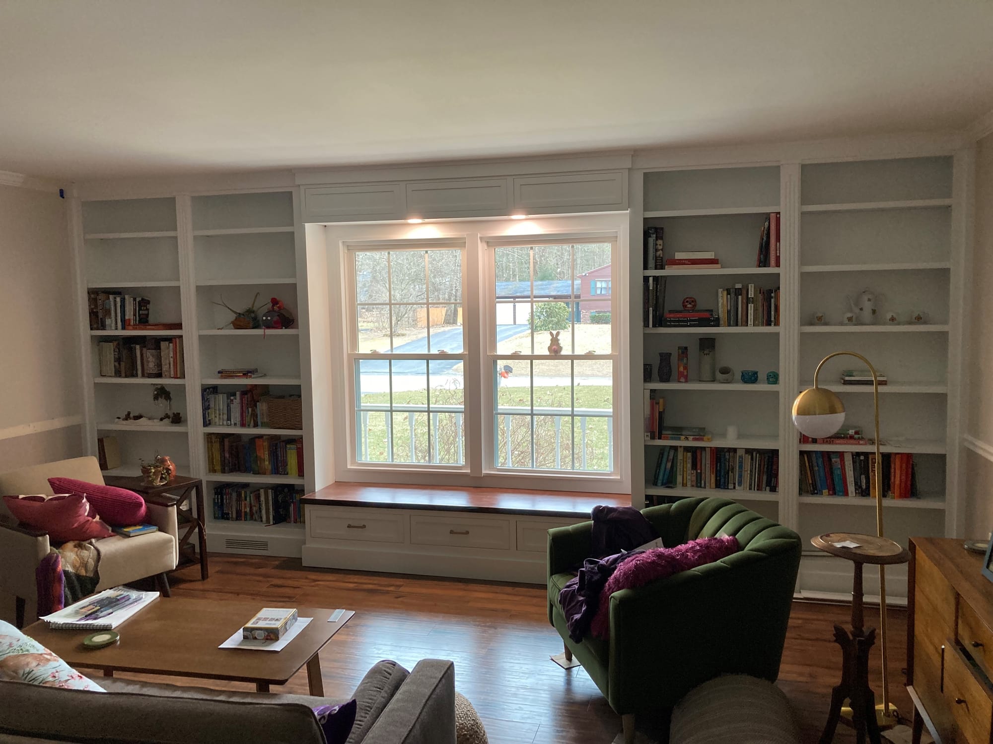 Custom bookcase and window bench with storage after