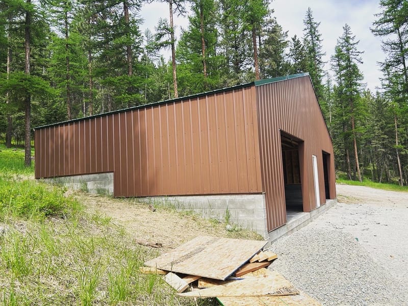 45'x25' storage building 4" slab 2' bar grid two 8'x10' overhead doors one exterior personal door