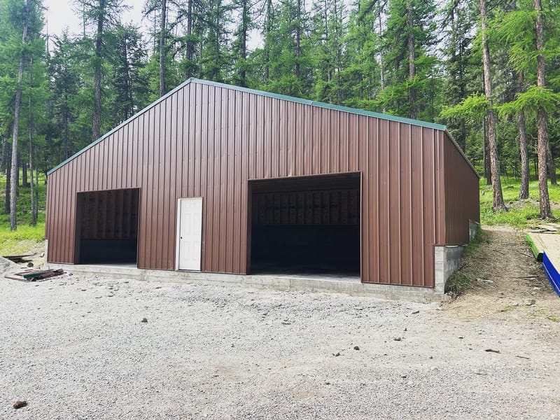 45'x25' storage building 4" slab 2' bar grid two 8'x10' overhead doors one exterior personal door