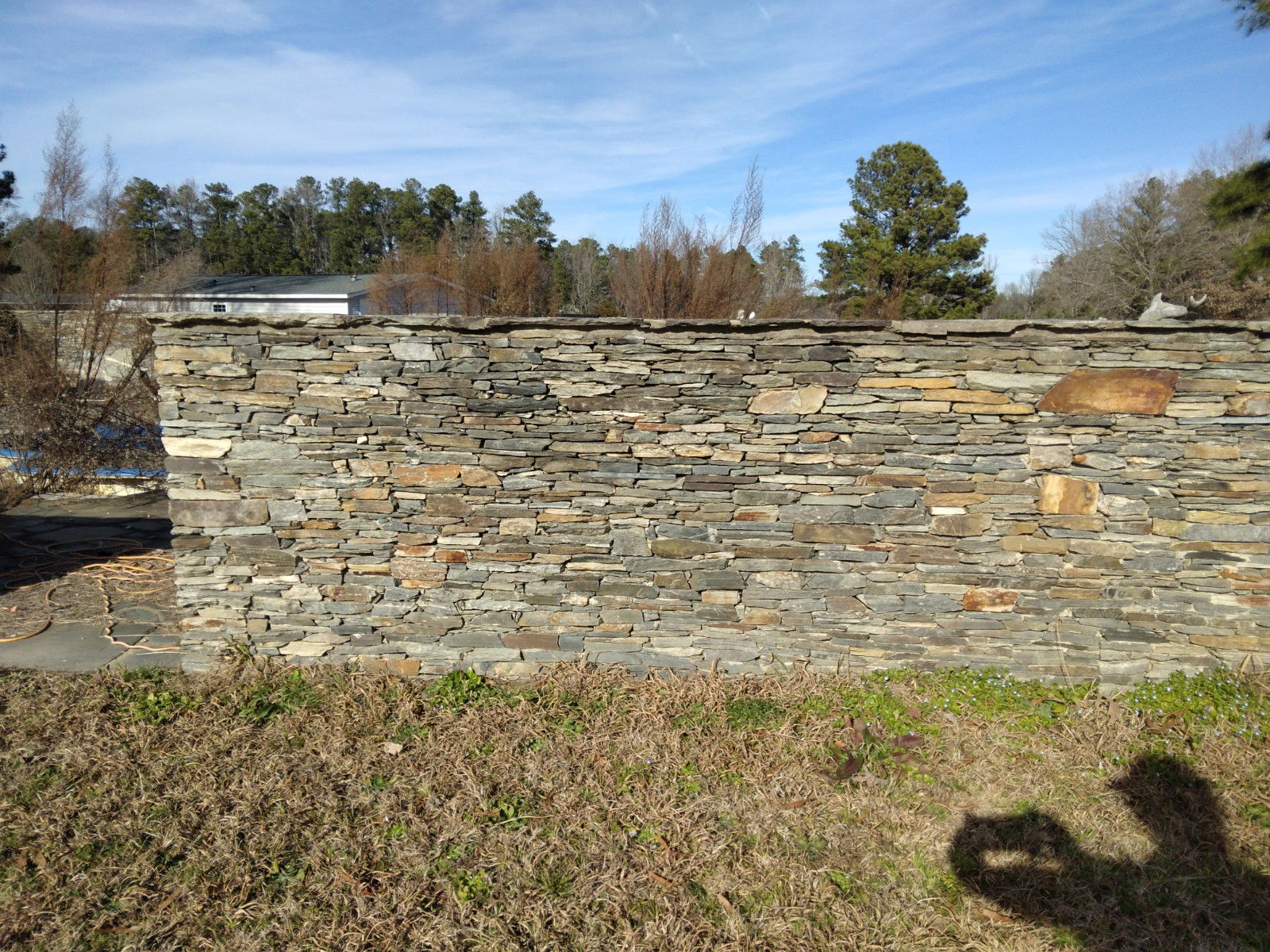 Pool Wall - This wall is built around a pool. It is double sided dry-staked with a mixture of different stones giving it the most unique look!

** This is at our location**