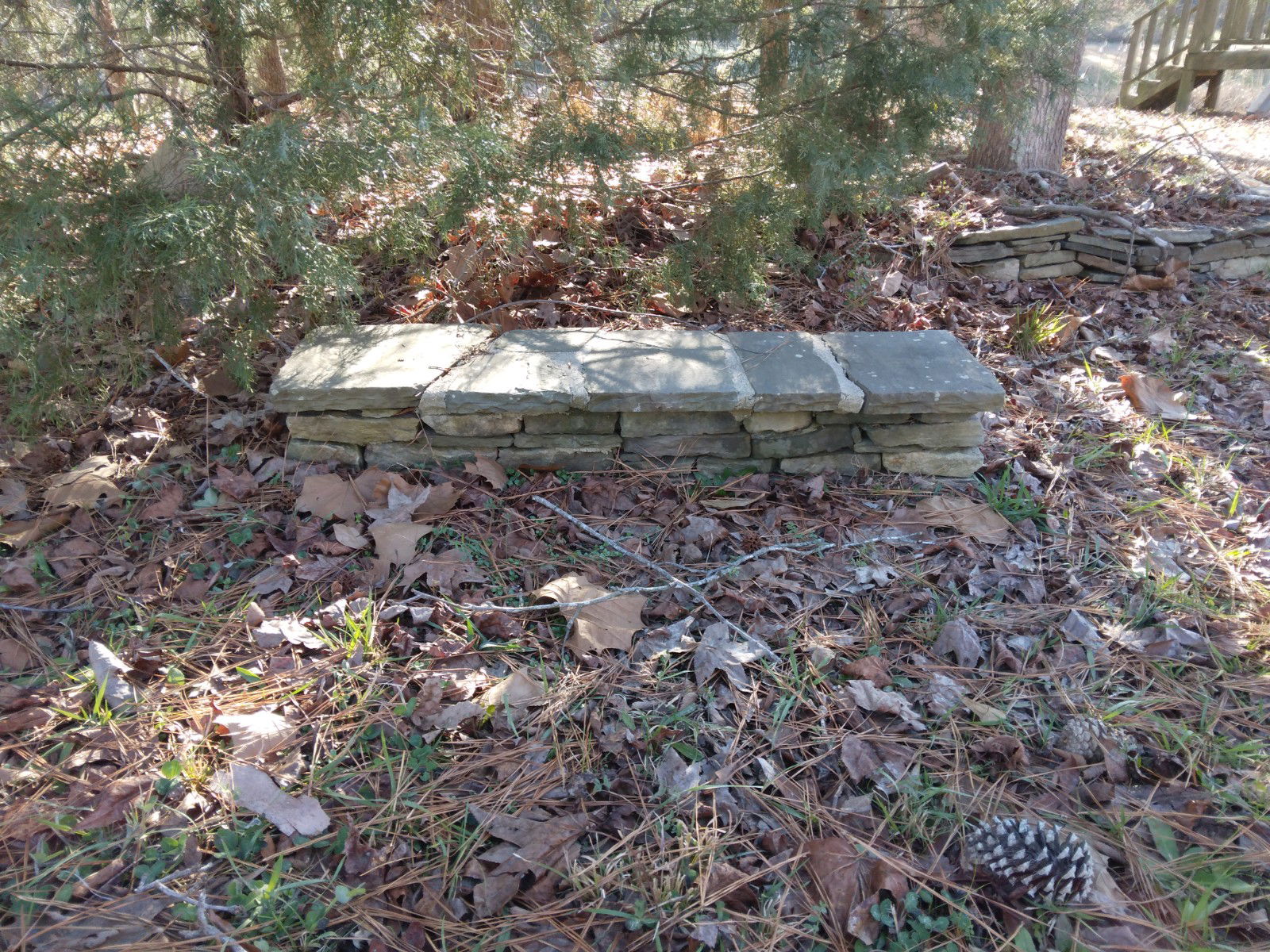 Bench - This bench was created by dry-stacking stone and adding a mantel piece cap.