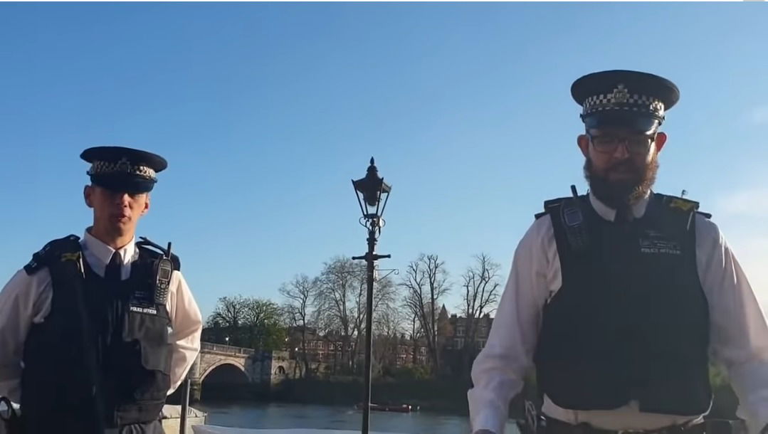 Woman arrested for sitting alone on a bench by a river