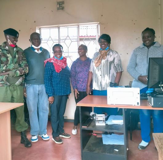A light moment after presentation of a motorbike to the Police Post within the Estate in 2021.