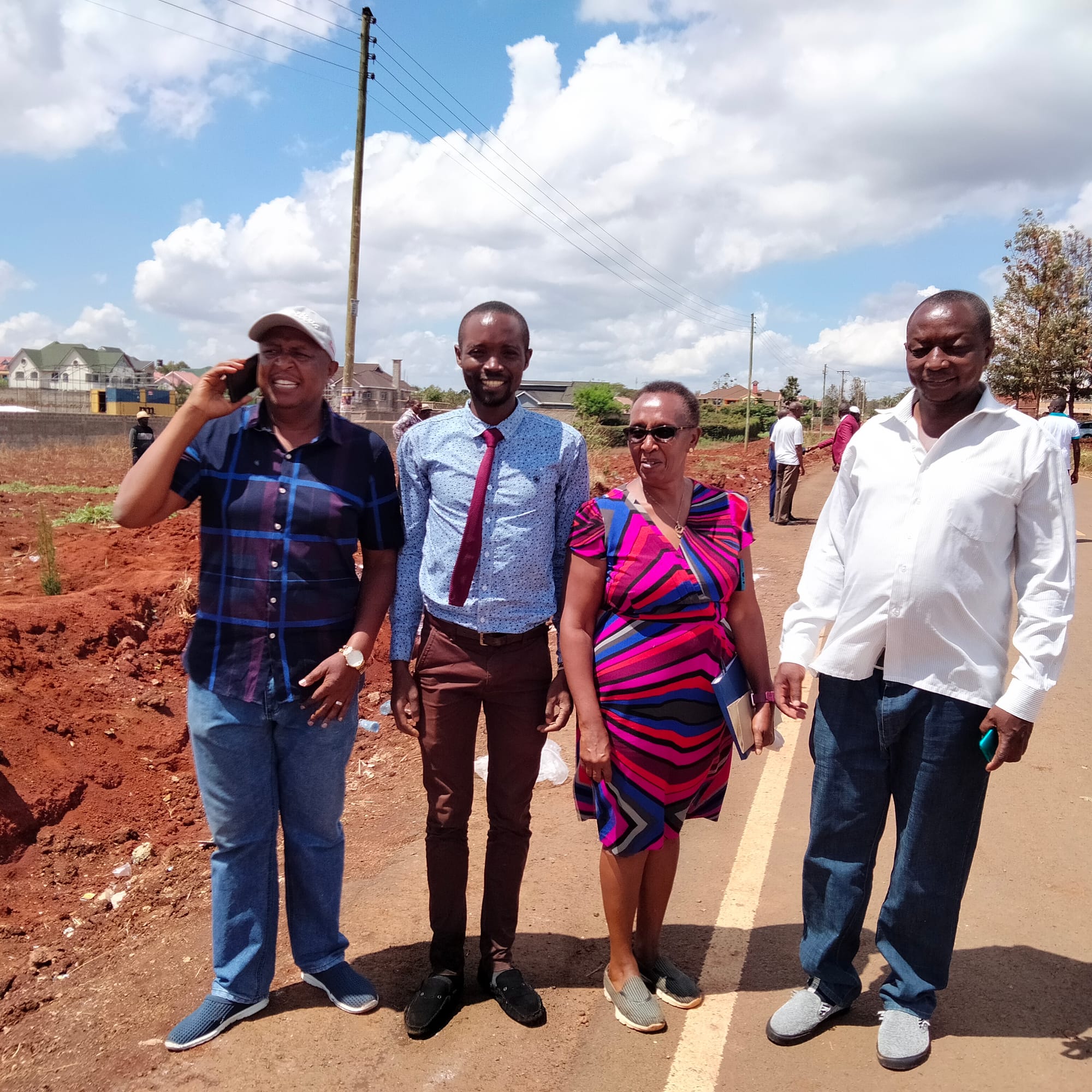 Association Officials with Estate Building Inspector