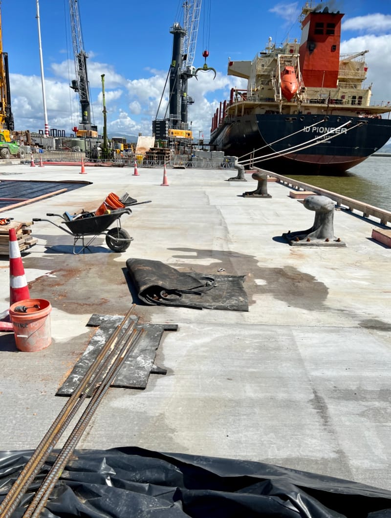 The fabricating, placing and fixing of Pile Plugs, Head Stocks, Capping Beams, Retaining walls and Deck Slabs.