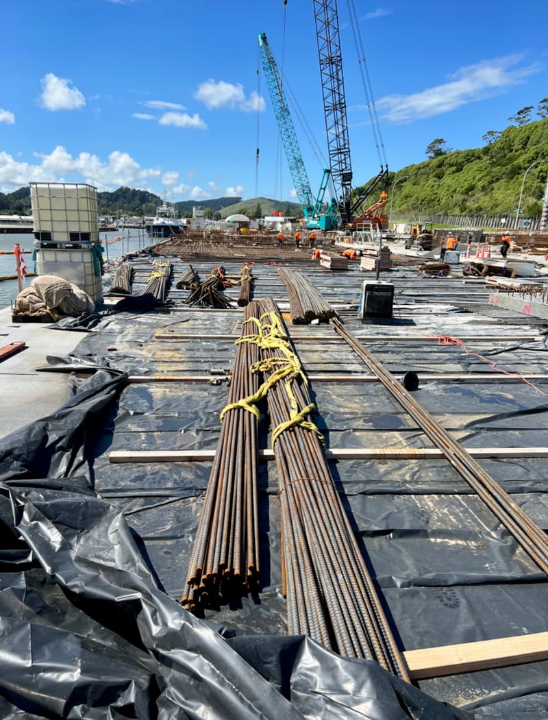 The fabricating, placing and fixing of Pile Plugs, Head Stocks, Capping Beams, Retaining walls and Deck Slabs.